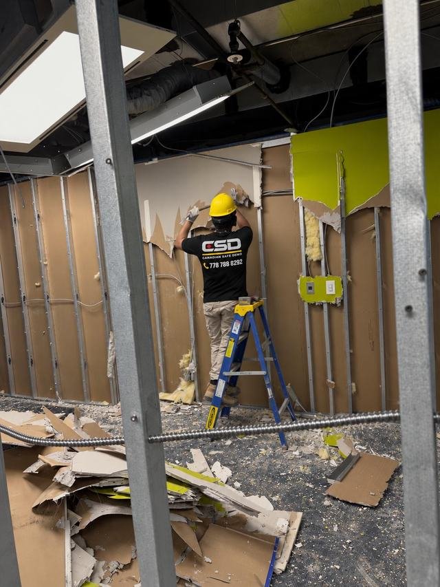 Wall board coming off steel studs in a strip-out