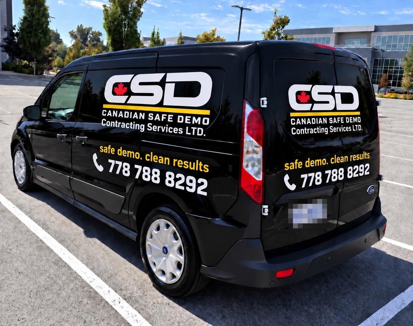 Canadian Safe Demo work van with the CSD logo and phone number